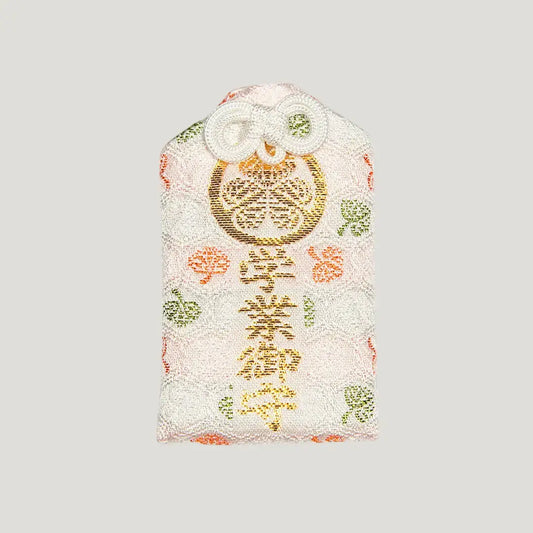 Front of 学業御守 (Academic Success Omamori) from Zojoji Temple – light pink charm with gold embroidery for studies and exam success