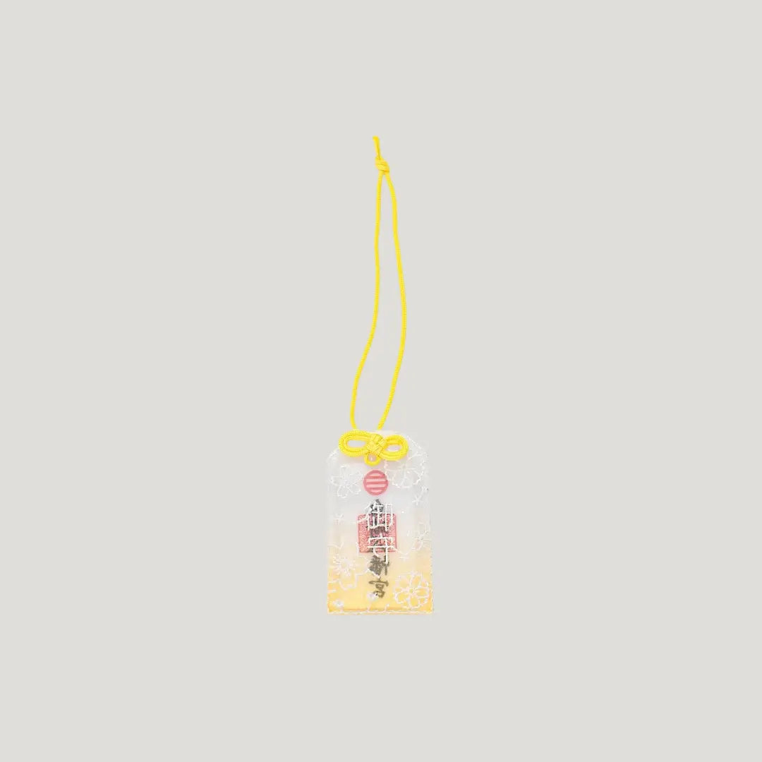 Embroidered Sakura Omamori with yellow cord and lace cherry blossom design from Shirasaki Shrine