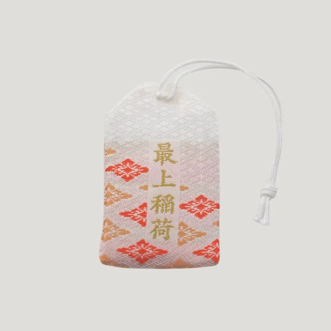 Back view of a traditional Japanese omamori for family safety from Saijo Inari temple, with white fabric and a subtle design.