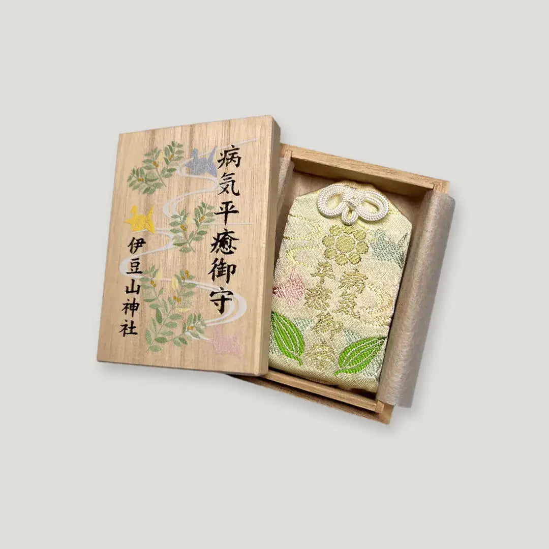 Healing omamori (病気平癒守) from Izusan Shrine in wooden box – traditional Japanese charm for recovery and well-being