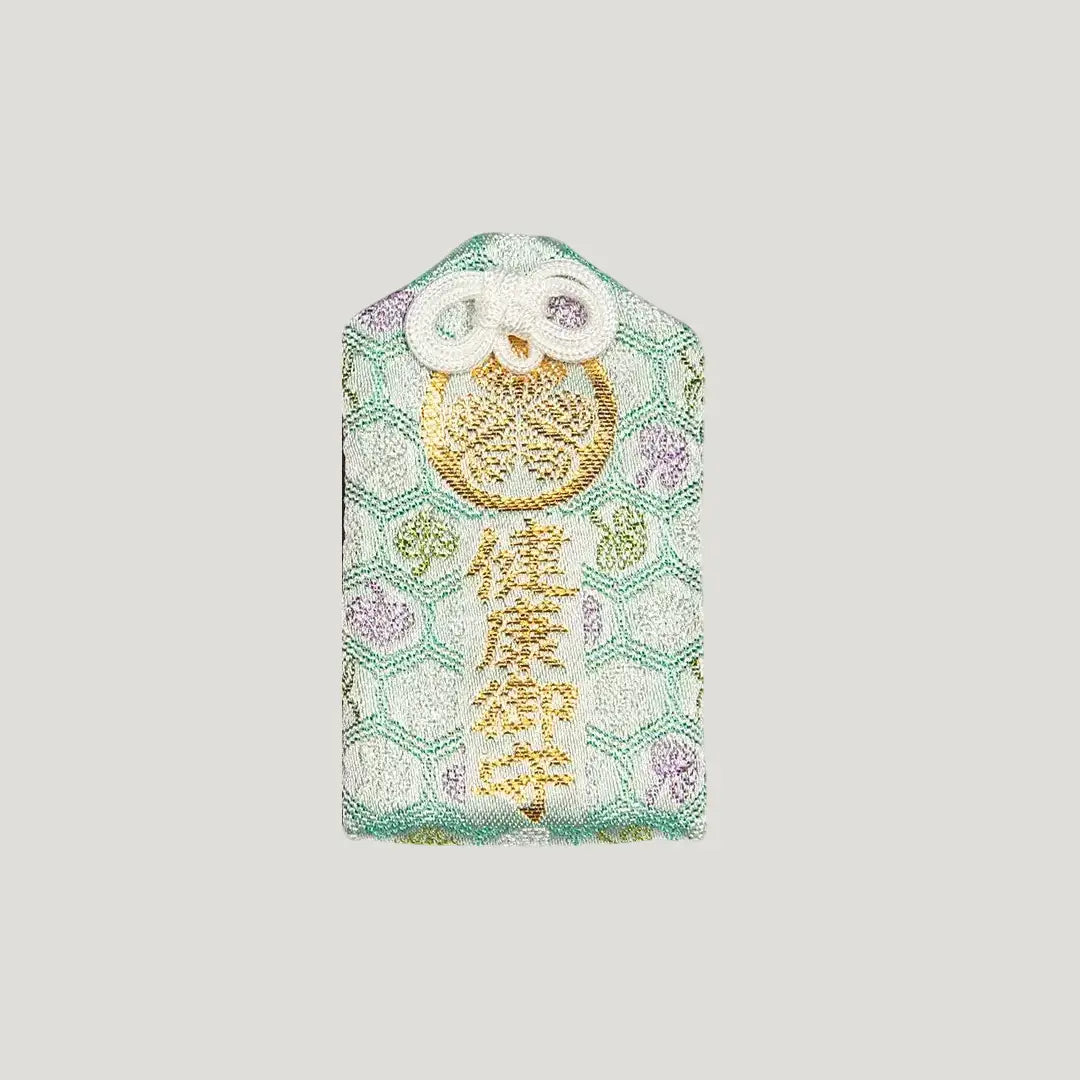 Front of 健康御守 (Health Protection Omamori) in green from Zojoji Temple – gold embroidery with floral hexagon pattern