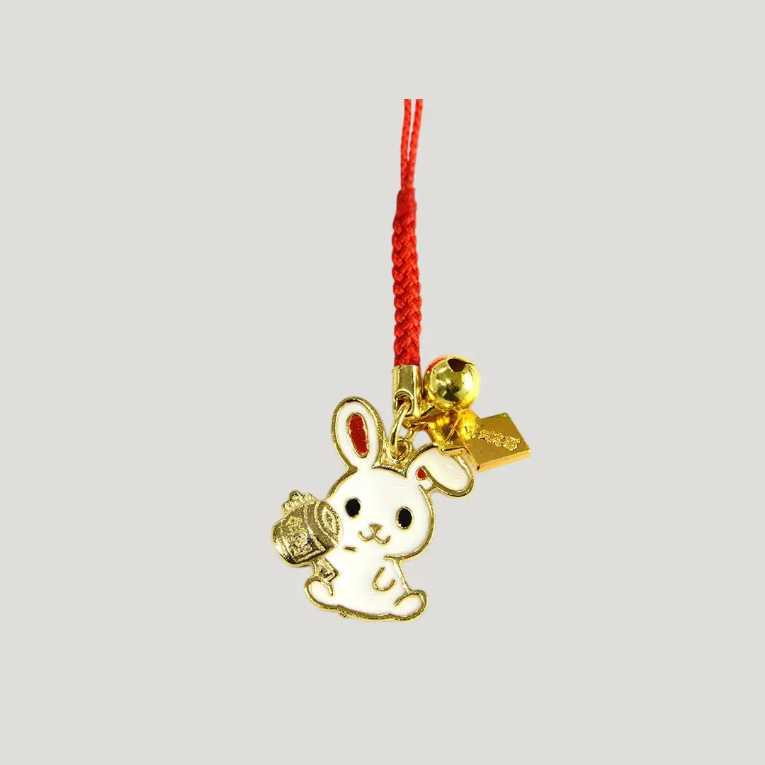 Lucky Mallet Rabbit Omamori gold rabbit charm with red cord from Shirasaki Shrine for wealth and prosperity