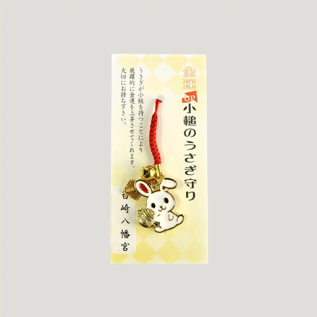 Lucky Mallet Rabbit Omamori from Shirasaki Shrine with gold rabbit charm and red cord for wealth and prosperity