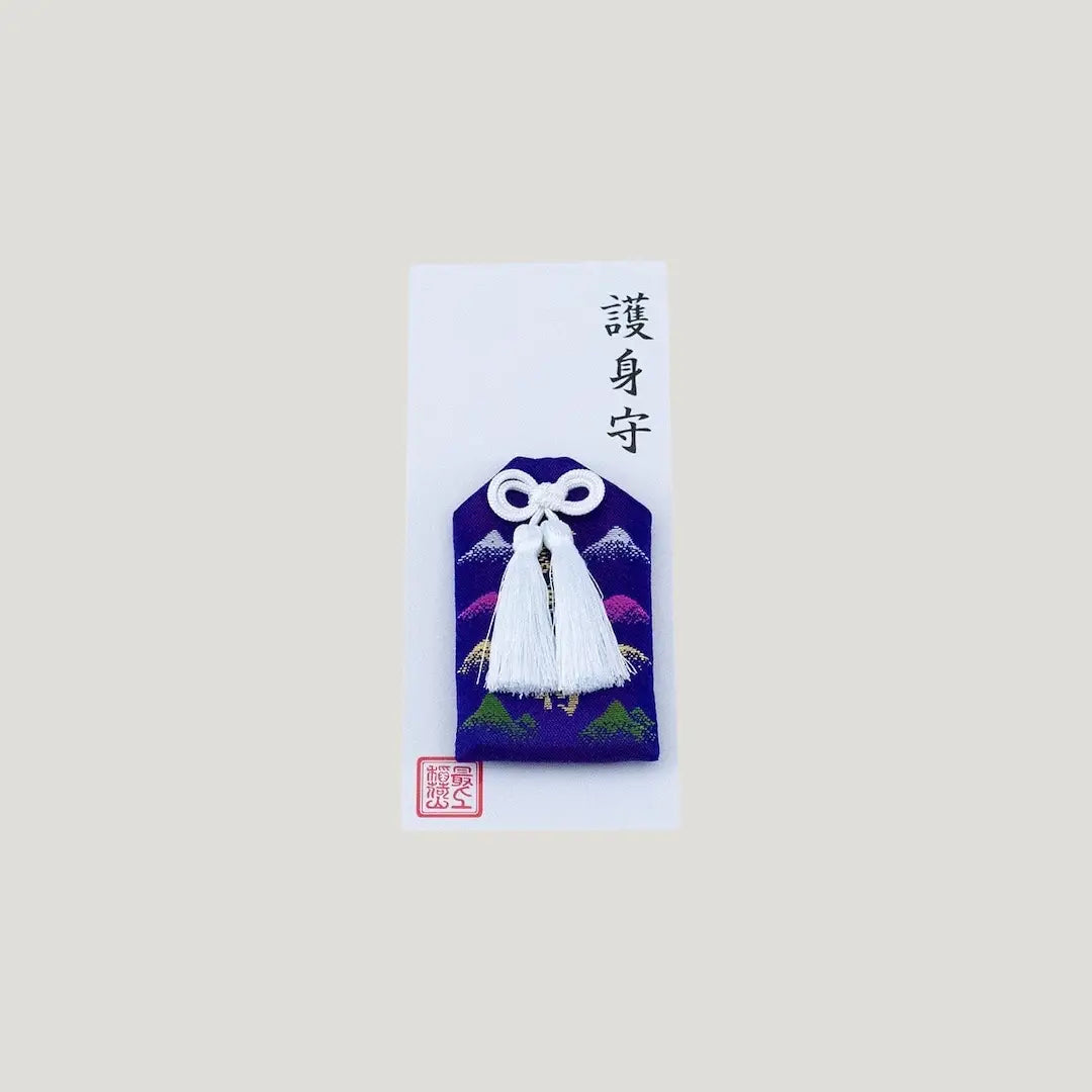 Blue Protection Omamori from Saijo Inari Shrine with gold and purple mountain design.
