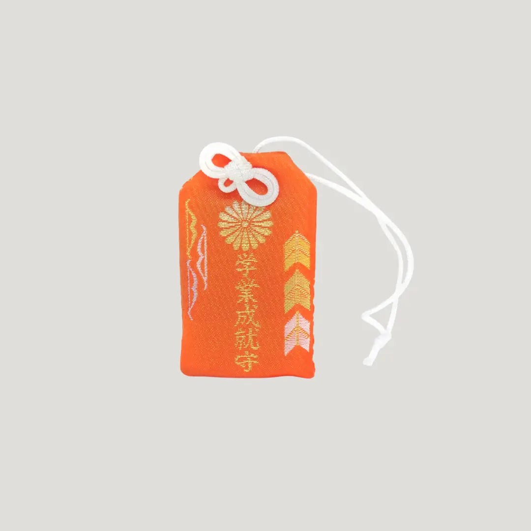 Study success omamori red from Omiya Hachimangu Shrine for exams and academic achievement