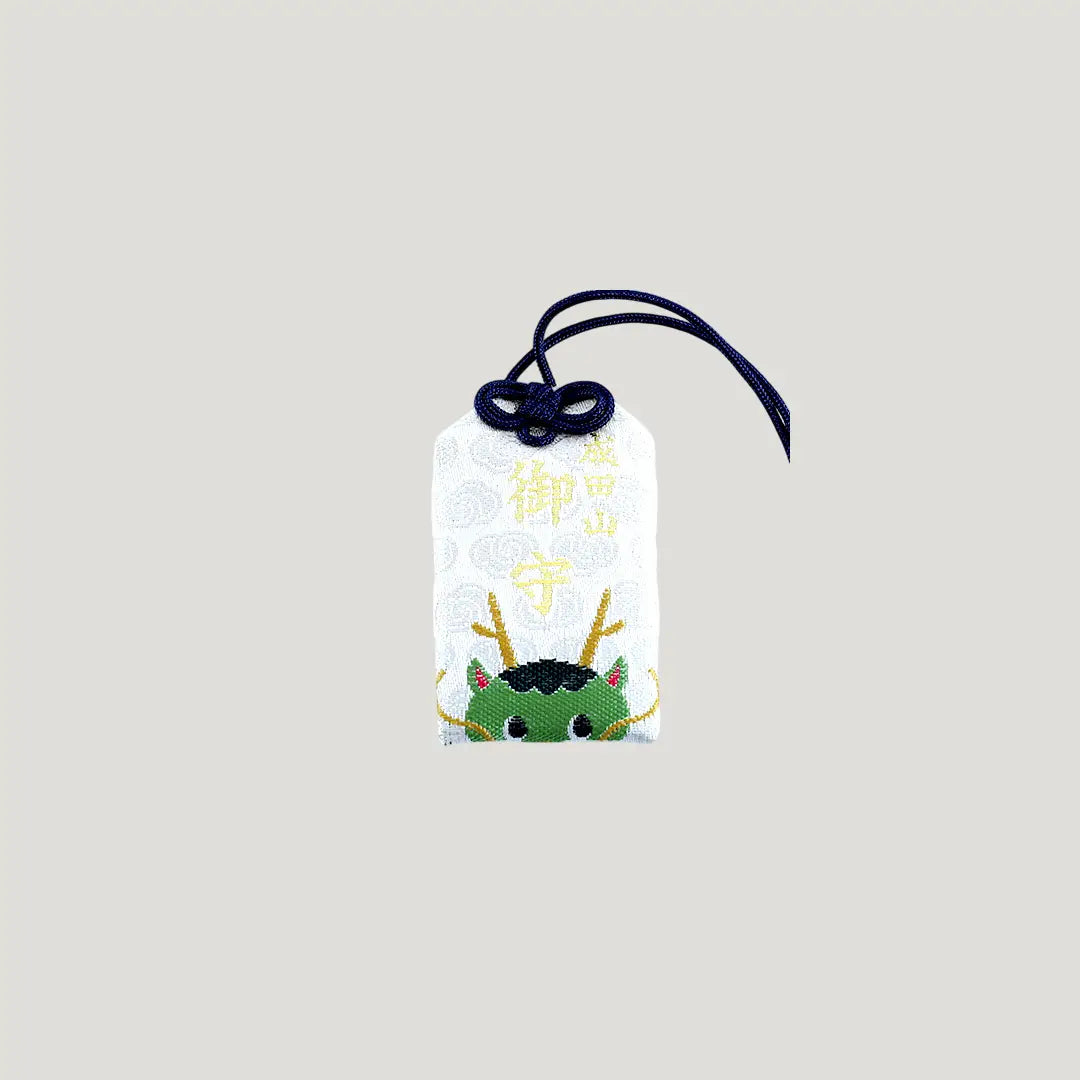 Dragon Zodiac Omamori from Osaka Naritasan Fudoson featuring green dragon face with navy cord