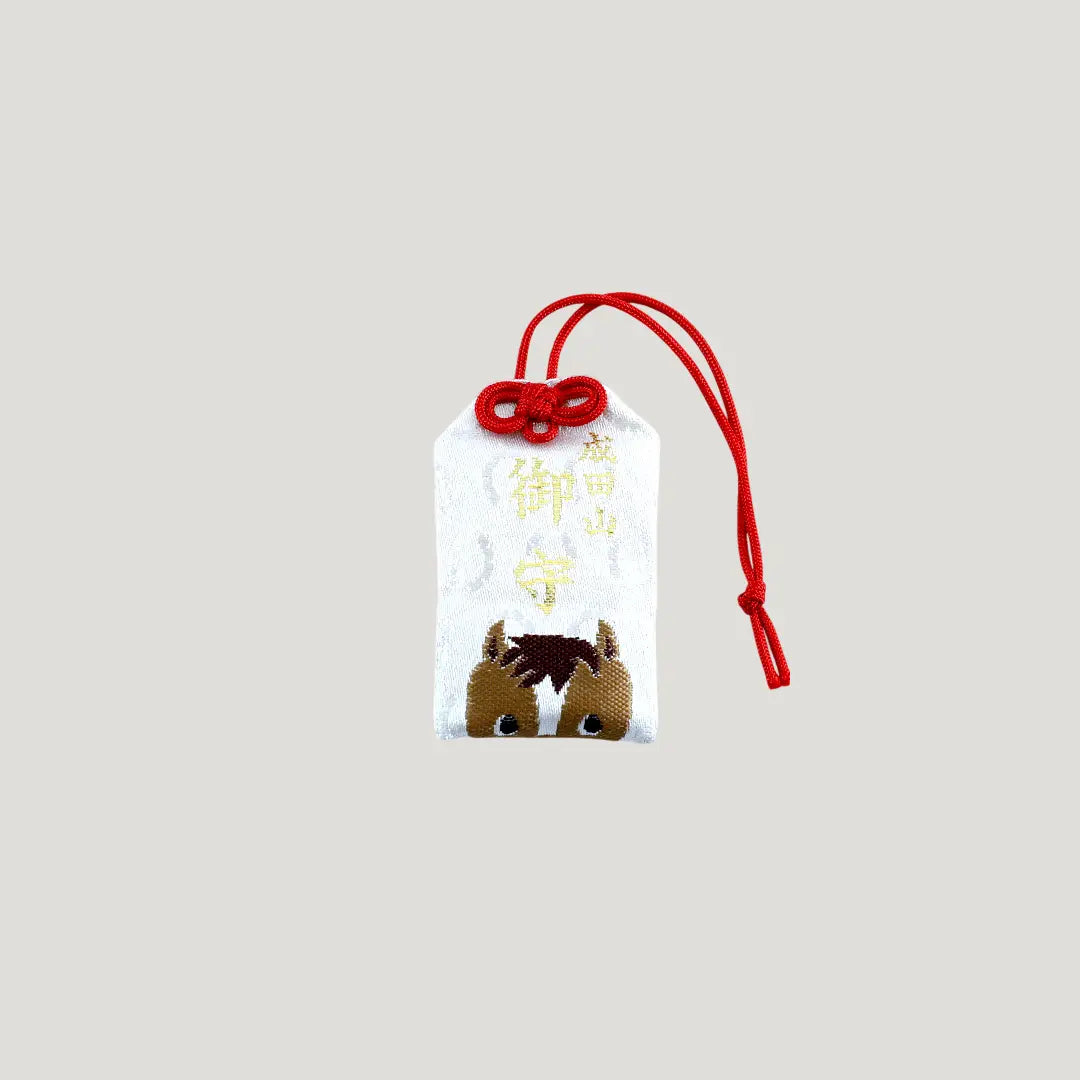 Horse Zodiac Omamori from Osaka Naritasan Fudoson featuring cute brown horse design with red cord