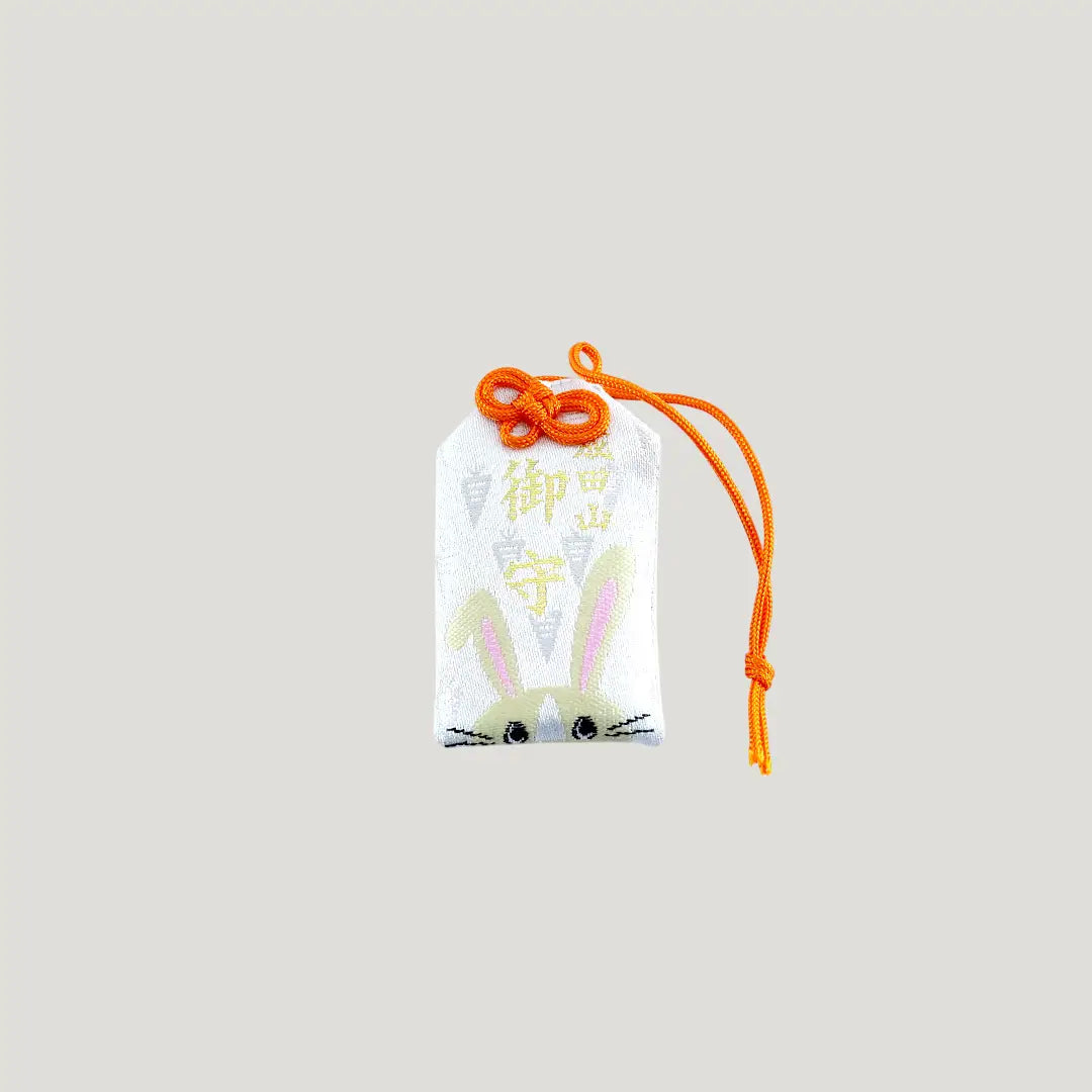 Rabbit Zodiac Omamori from Osaka Naritasan Fudoson featuring long ears and orange cord