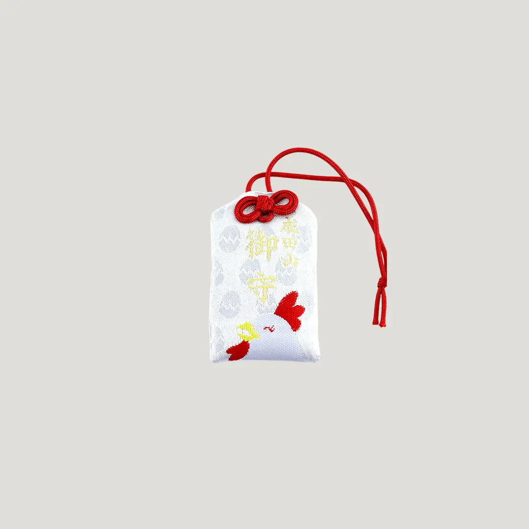 Rooster Zodiac Omamori from Osaka Naritasan Fudoson with white chicken design and red cord