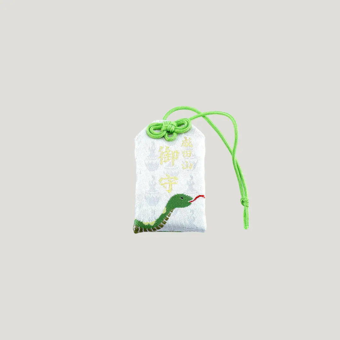 Snake Zodiac Omamori from Osaka Naritasan Fudoson featuring green snake design with green cord