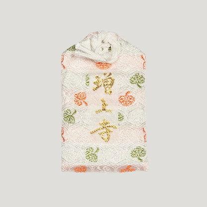 Back of 学業御守 (Academic Success Omamori) from Zojoji Temple – light pink charm with 増上寺 embroidered in gold