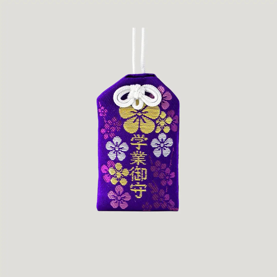 Academic success omamori from Dazaifu Tenmangu Shrine with plum blossom design for studies and exams