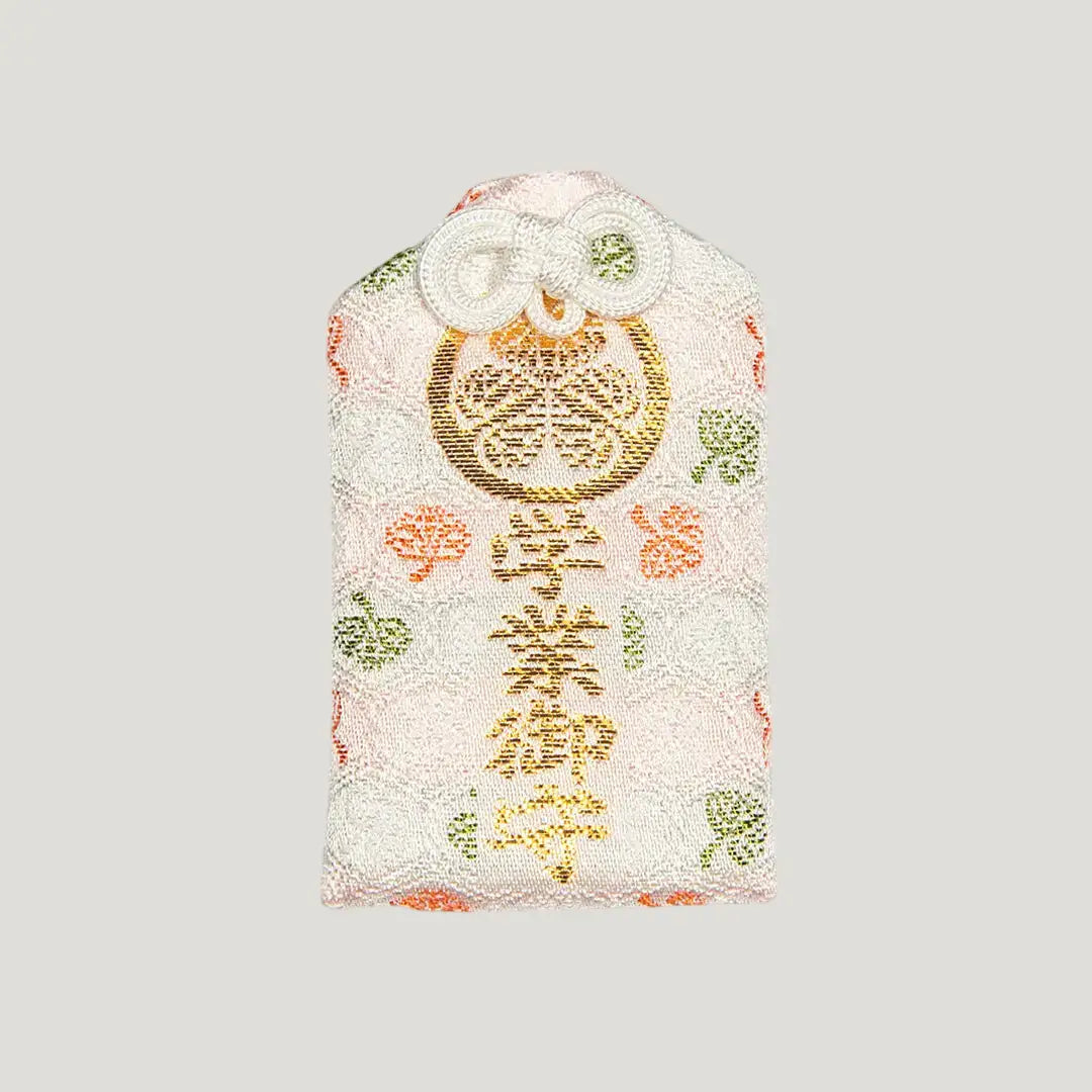 Front of 学業御守 (Academic Success Omamori) from Zojoji Temple – light pink charm with gold embroidery for studies and exam success