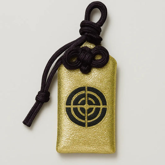 Front of all-purpose protection omamori (十一面守) from Hasedera Temple, gold variant – Japanese charm for health, safety, and blessings