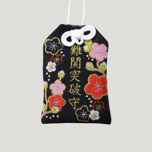 Barrier Breakthrough Omamori (難関突破肌守り・梅の花柄) front view – black Japanese charm with colorful plum blossom embroidery from Shirasaki Shrine, for success and overcoming challenges