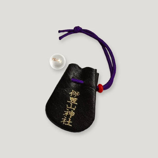 Black crystal omamori (水晶玉) from Izusan Shrine – traditional Japanese charm for protection, good luck, and longevity