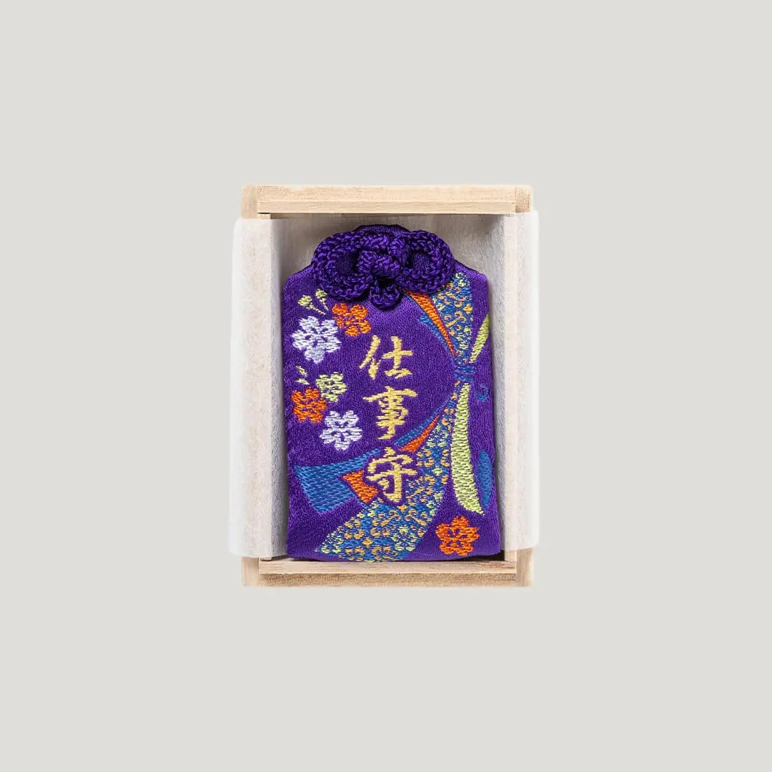 Career Success Omamori with purple embroidery in wooden box from Shirasaki Shrine for job luck and work success