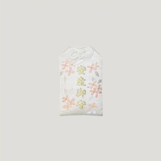 White and pink floral omamori for safe childbirth from Sensoji Temple in Tokyo