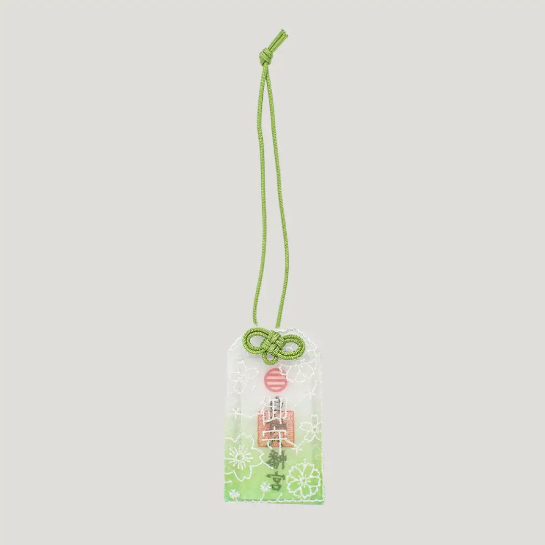 Embroidered Sakura Omamori with green cord and lace cherry blossom design from Shirasaki Shrine