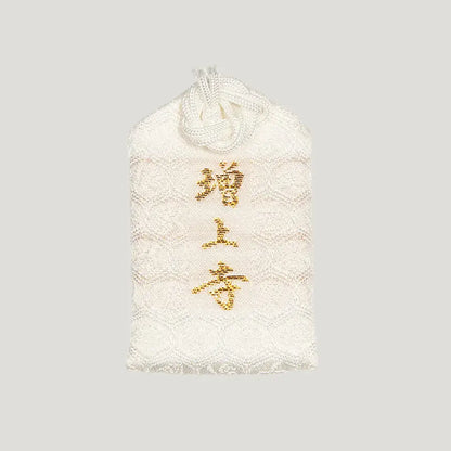 Back of 合格御守 (Exam Success Omamori) from Zojoji Temple – white charm with 増上寺 embroidered in gold
