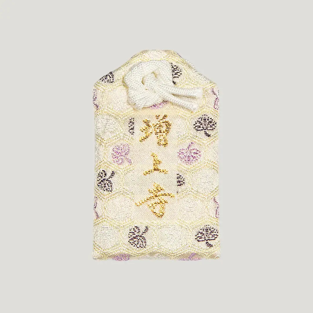 Back of 家内安全御守 (Family Safety Omamori) from Zojoji Temple – white fabric charm with 増上寺 embroidered in gold