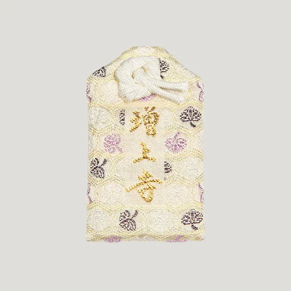 Back of 家内安全御守 (Family Safety Omamori) from Zojoji Temple – white fabric charm with 増上寺 embroidered in gold