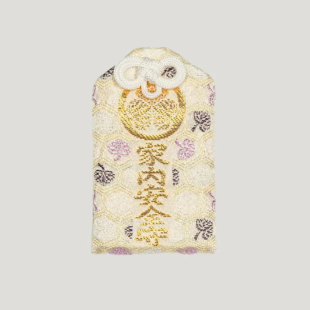Front of 家内安全御守 (Family Safety Omamori) from Zojoji Temple – white and gold charm embroidered for household protection and well-being