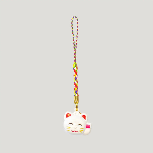Fortune Beckoning Cat Omamori – white maneki-neko bell charm with multicolor strap from Shirasaki Shrine, symbolizing luck, wealth, and relationships