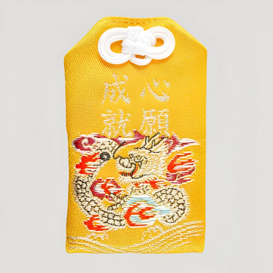 Front of wish-fulfillment omamori (心願成就守) from Senso-ji Temple, yellow variant – authentic Japanese omamori