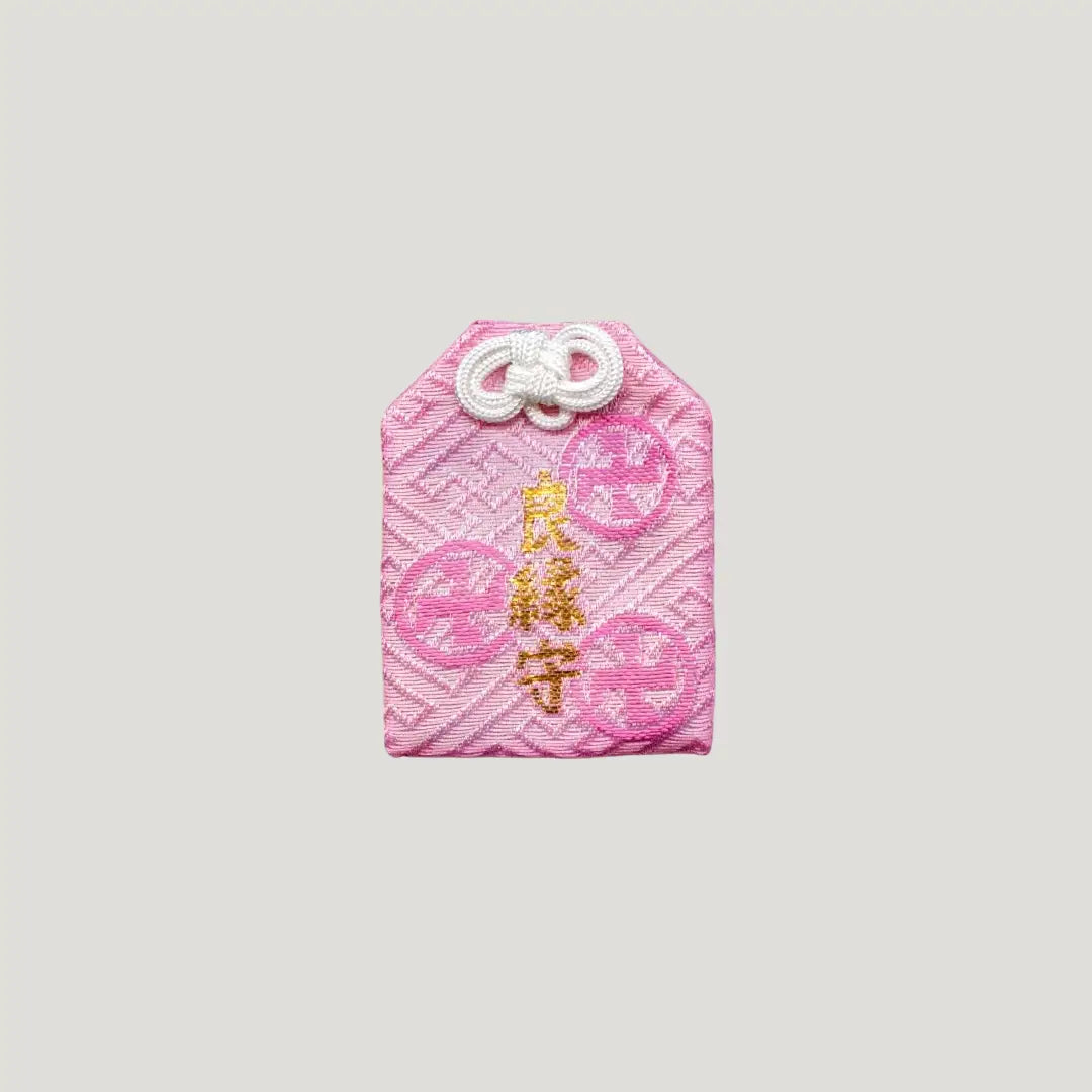 Good Match Omamori from Sensoji Temple in pink with sakura design, symbolizing romantic warmth and emotional bonds