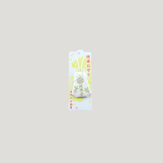 Health Omamori from Osaka Naritasan Fudoson with soft white fabric, gold crest, and green bamboo embroidery for wellness and protection