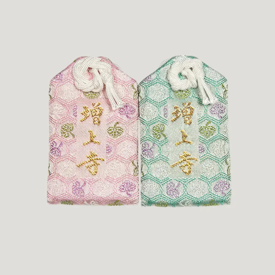 Back of 健康御守 (Health Protection Omamori) from Zojoji Temple – pink and mint green variants with 増上寺 embroidery. Sold individually.