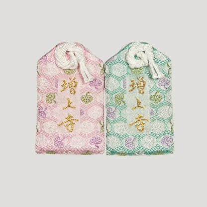 Back of 健康御守 (Health Protection Omamori) from Zojoji Temple – pink and mint green variants with 増上寺 embroidery. Sold individually.