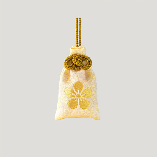 Longevity and health omamori with plum blossom from Dazaifu Tenmangu Shrine for long life and well-being