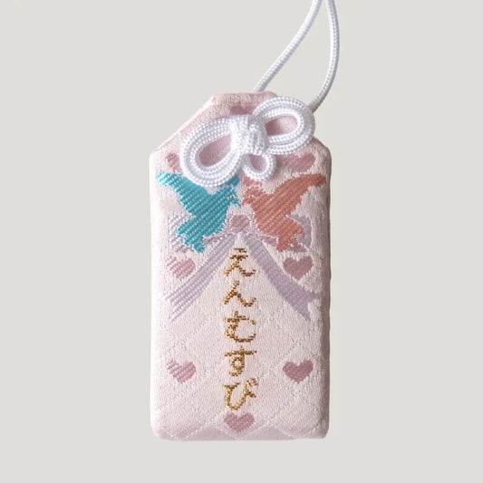 Love Omamori from Koenji Hikawa Shrine in pink with heart patterns and butterflies symbolizing romantic blessings and emotional harmony