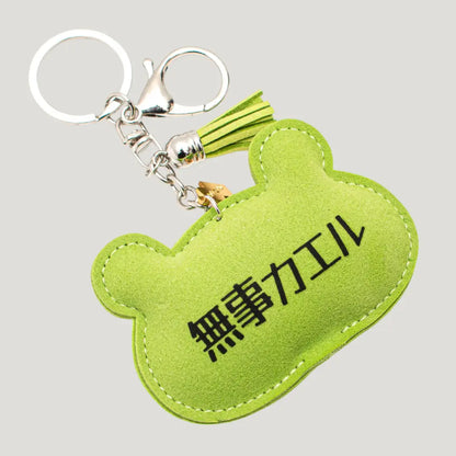 Lucky Frog Omamori (三福かえる守) back side – detail of green frog charm, authentic omamori from Shirasaki Shrine, Japan