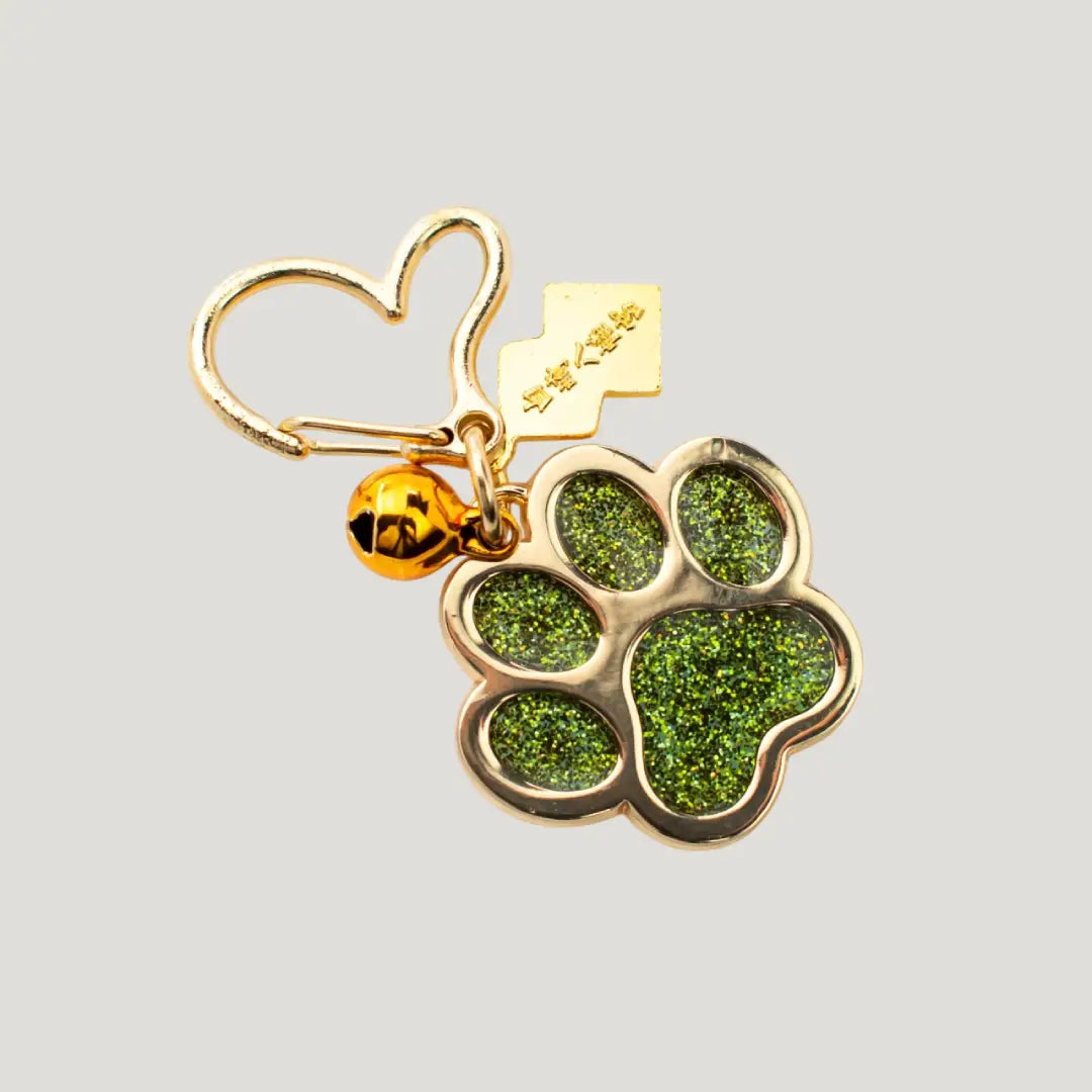 Pet Joy Omamori (ペットよろこび守) – glittery green paw-shaped Japanese charm with gold heart clip from Shirasaki Shrine, for pet happiness and well-being