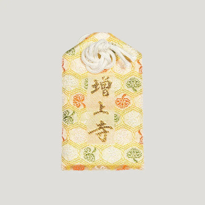 Back of 厄除御守 (Protection from Misfortune Omamori) from Zojoji Temple – brocade fabric with 増上寺 embroidered in gold