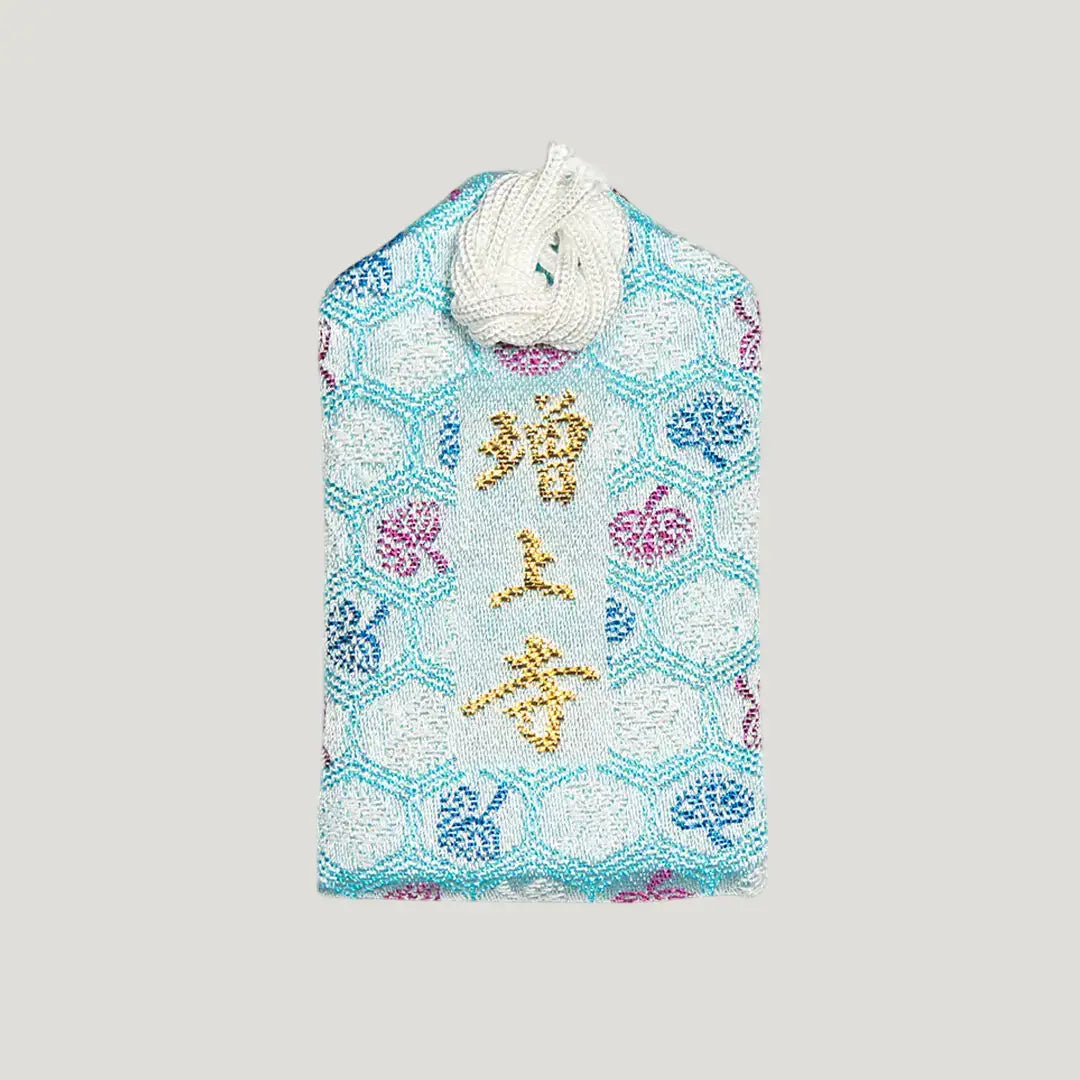Back of 交通安全御守 (Safe Travel Omamori) from Zojoji Temple – light blue brocade with 増上寺 in gold and multicolor embroidery