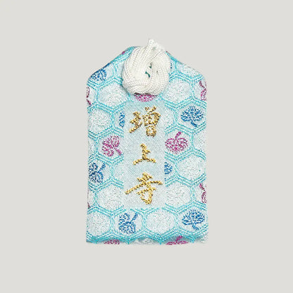 Back of 交通安全御守 (Safe Travel Omamori) from Zojoji Temple – light blue brocade with 増上寺 in gold and multicolor embroidery