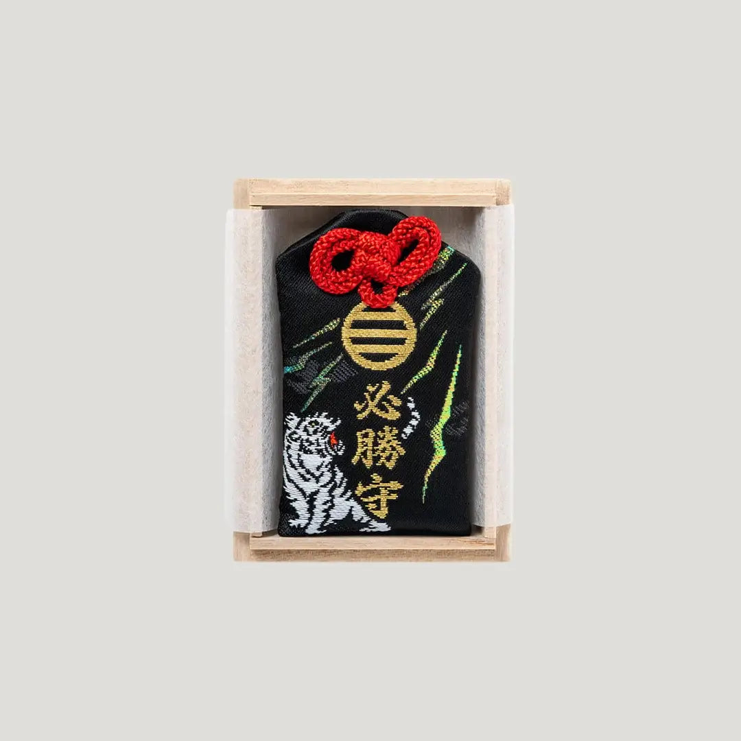 Sure Victory Omamori – 必勝お守り from Shirasaki Shrine in black with dragon and white tiger embroidery, includes wooden gift box
