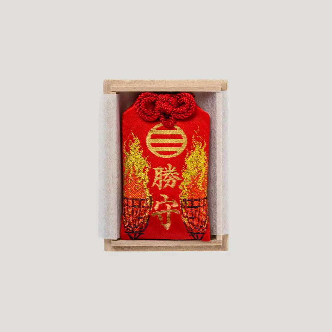 Victory Fortune Omamori in a wooden presentation box from Shirasaki Hachimangu in Japan, symbolizing success and winning outcomes