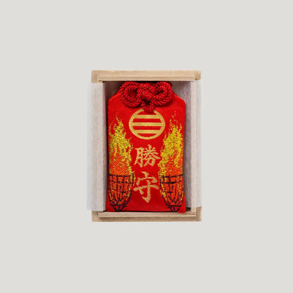 Victory Fortune Omamori in a wooden presentation box from Shirasaki Hachimangu in Japan, symbolizing success and winning outcomes