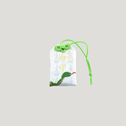 Snake Zodiac Omamori from Osaka Naritasan Fudoson featuring green snake design with green cord